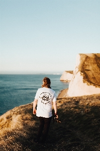 Man beach sea coast Photo