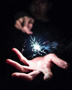 Hand sparkler darkness Photo