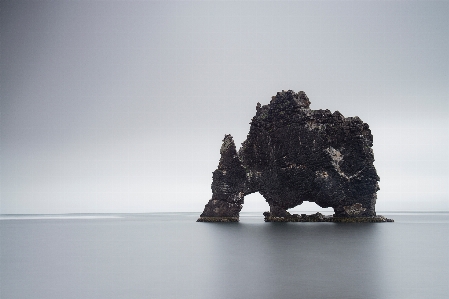 Rock wood statue reflection Photo