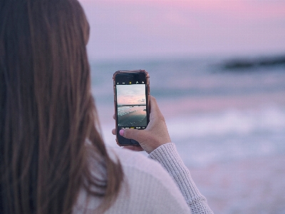 Hand sea sky girl Photo