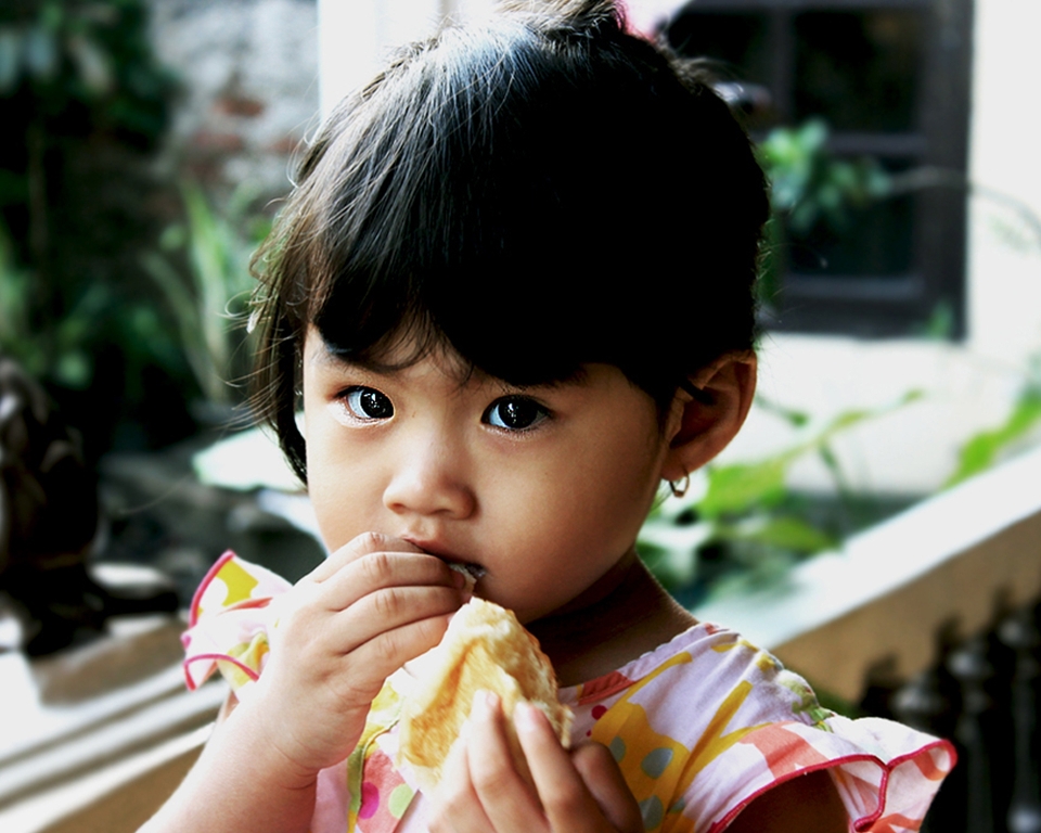 Girl child smile eating