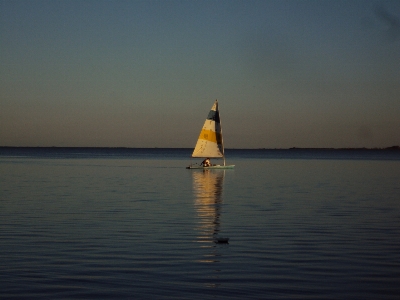 Sunset beach sail water Photo