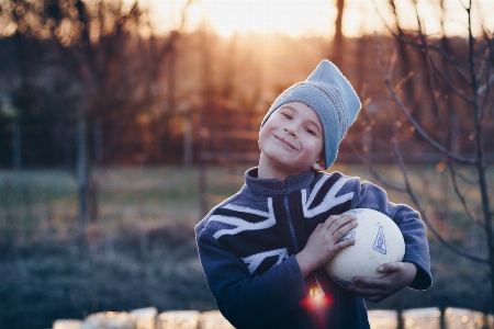 Kid happy golden sunset Photo