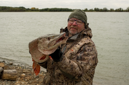 Fisherman pike fish river Photo