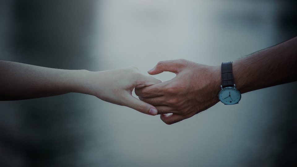 Blurred background hands holding human