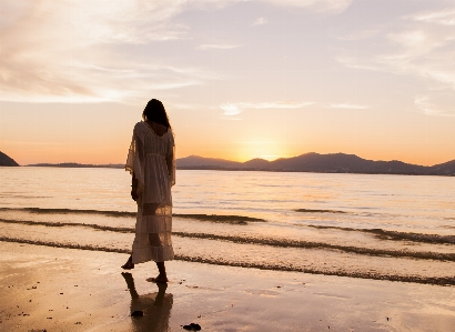 Sun beach girl sky Photo