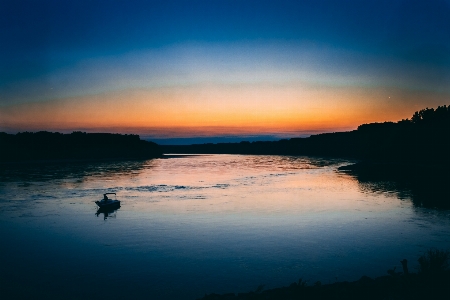 Sunset boat sailing orange Photo