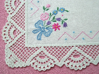 Crocheted pink lace doily Photo