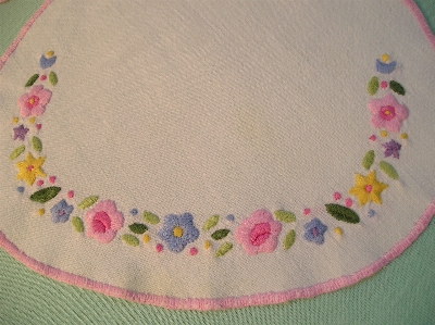 Embroidered pink needlework textile Photo