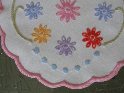 Embroidered pink flower needlework Photo