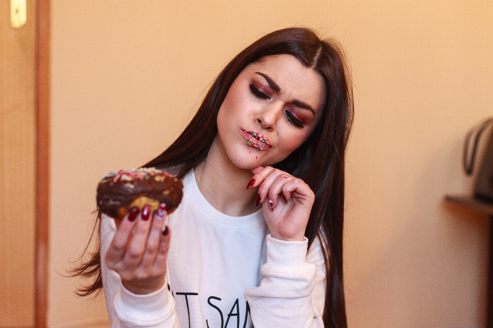 Smile girl eating cookies