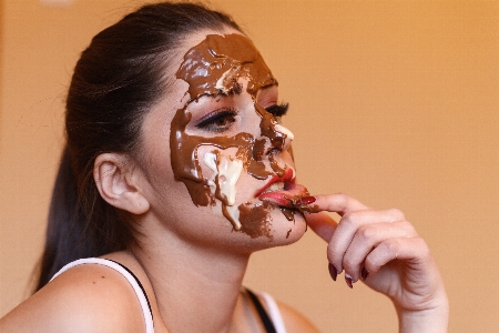 Smile girl eating cookies Photo