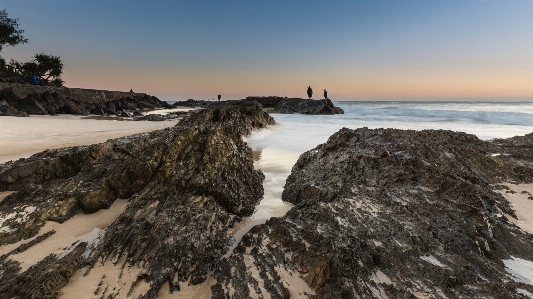 Landscape sunrise rocks beach Photo