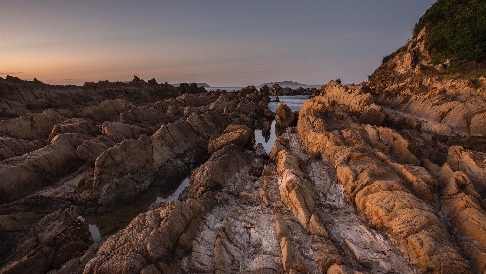 Landscape sunrise rocks beach