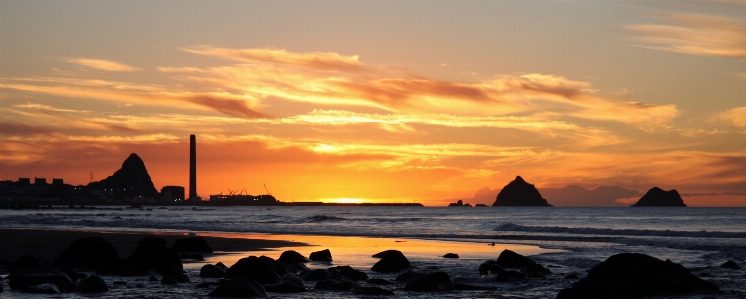 Landscape sunset beach rocks Photo