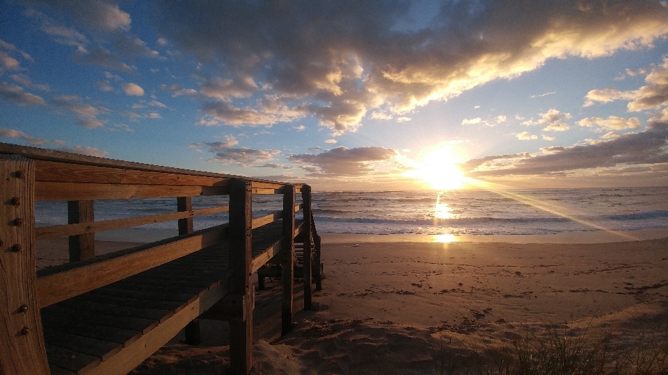 Beach sunrise ocean clouds