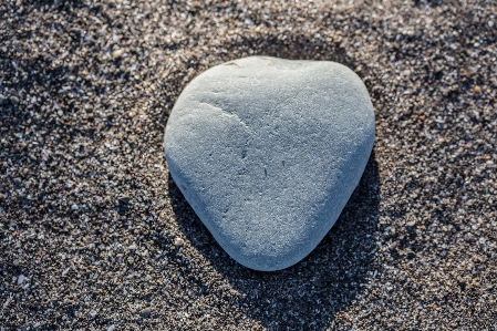 Rock heart shape beach pebble Photo