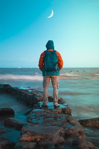 Man ocean coast moon Photo