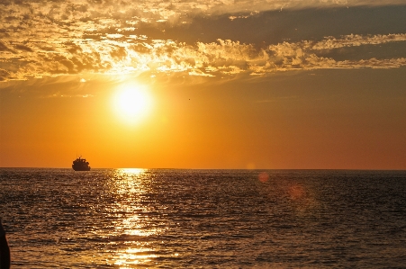 Sunset beach horizon sea sky Photo