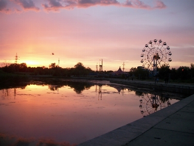 Sunset embankment ferris wheel reflection Photo