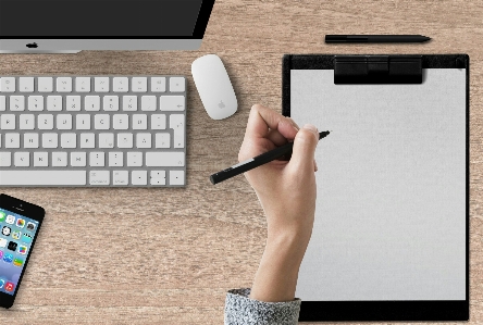 Hand clipboard computer workplace Photo