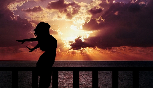 Woman happiness sunrise silhouette Photo