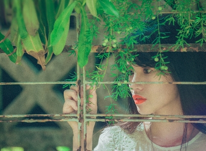 Beautiful girl green leaf Photo