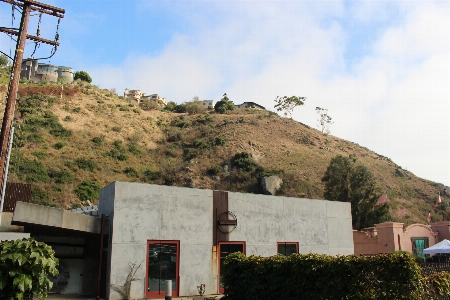 Hillside slope utility pole building Photo