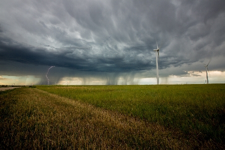 Lightning windmills wind turbine clouds Photo