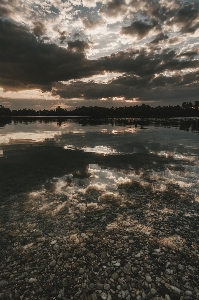 Sunset mirroring lake reflection Photo