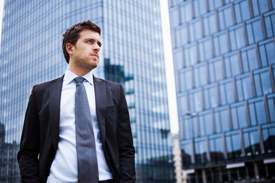 Businessman suit blue building