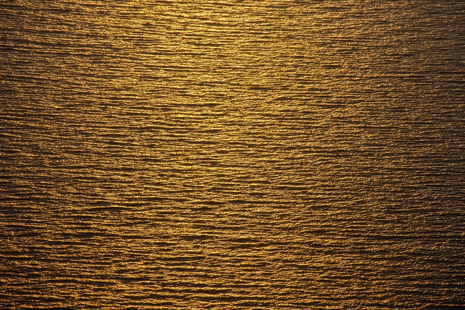 Mar oro textura crepúsculo