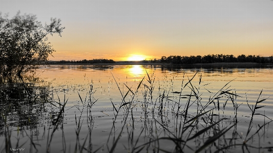 Sunset water reflection sky Photo