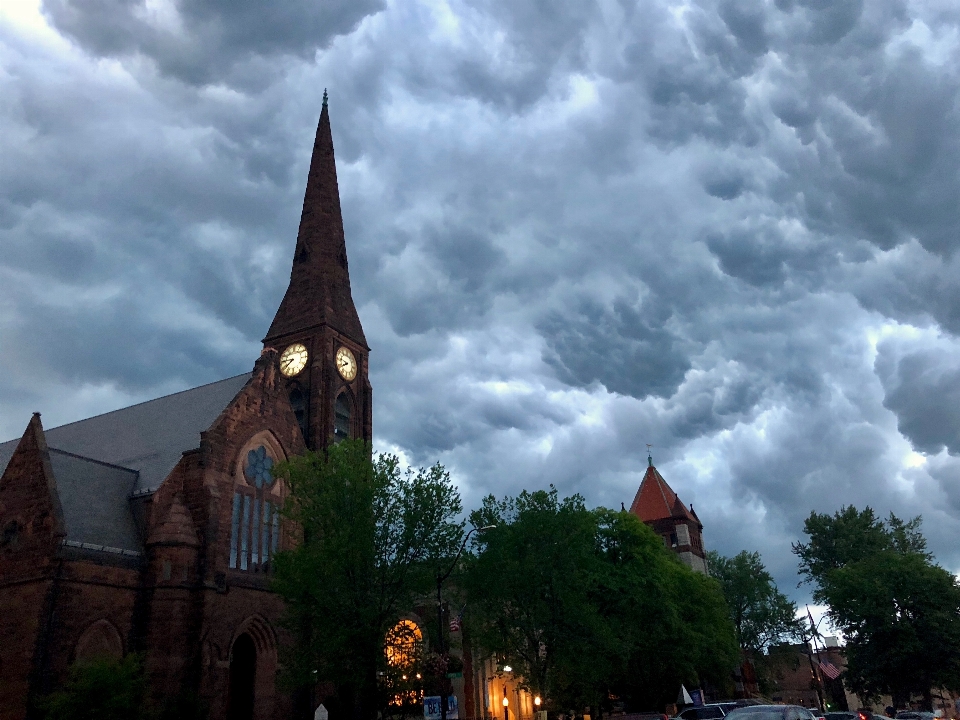 Storm clouds church steeple clock northampton