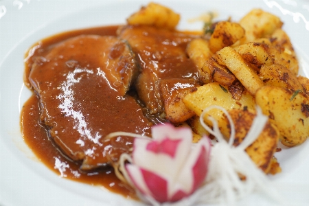 Potatoes meat sauce radishes Photo