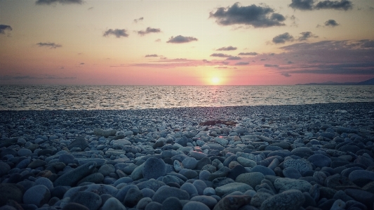 Sky clouds sun stones Photo