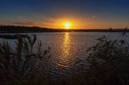 Sunset water reflection sky Photo