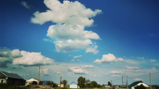 Sky clouds blue village Photo