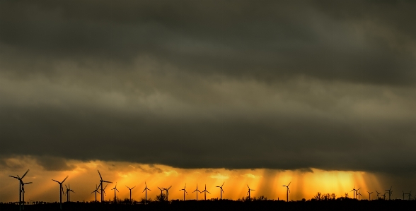 Windmills clouds sunlight wind Photo