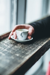 Photo Tasse à café tableau main