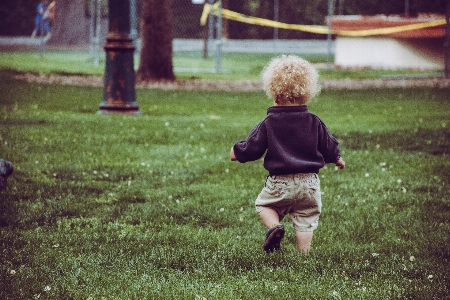 Child grass green photograph Photo