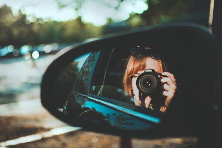 Reflection rear view mirror green automotive Photo