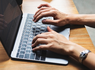 Computer keyboard nail hand typing Photo