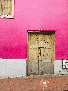 Red wall pink door Photo