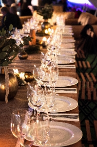 Rehearsal dinner restaurant lighting champagne stemware Photo