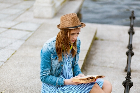 Street fashion beauty sun hat sitting Photo