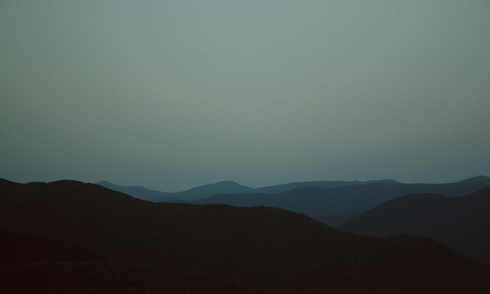 Sky mountainous landforms atmospheric phenomenon hill