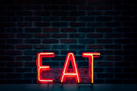 Red text neon sign Photo