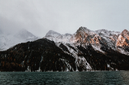 Mountain mountainous landforms water sky Photo