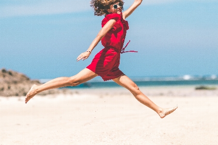 Jumping vacation fun sand Photo